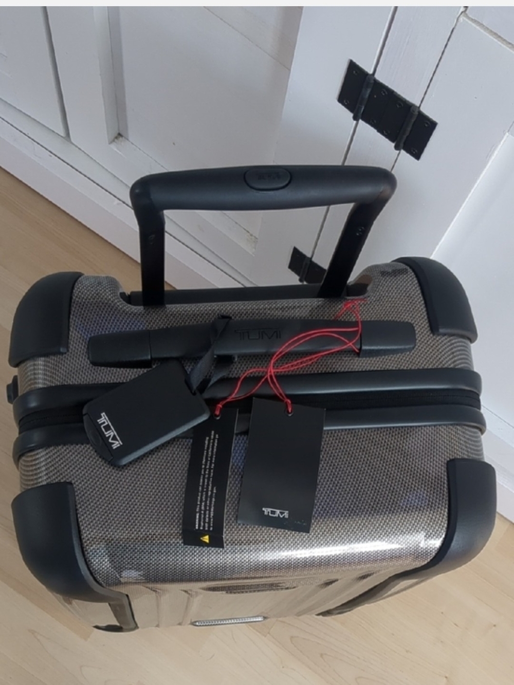 TUMI Hardshell 22" Carry-On Roller in Metallic Tan-Beige. - Picture 2 of 10